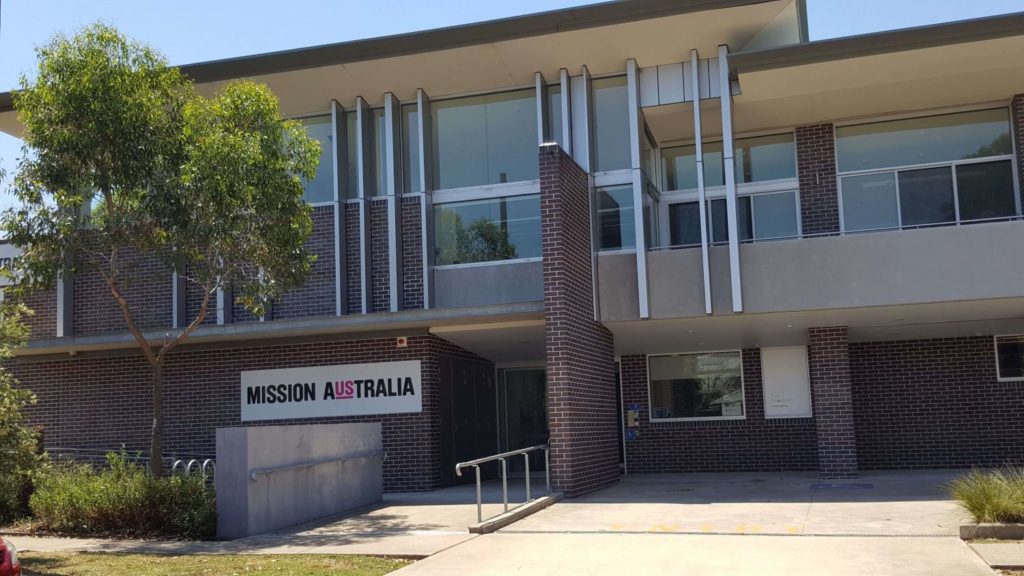 Photo of external view of modern looking Mission Australia building